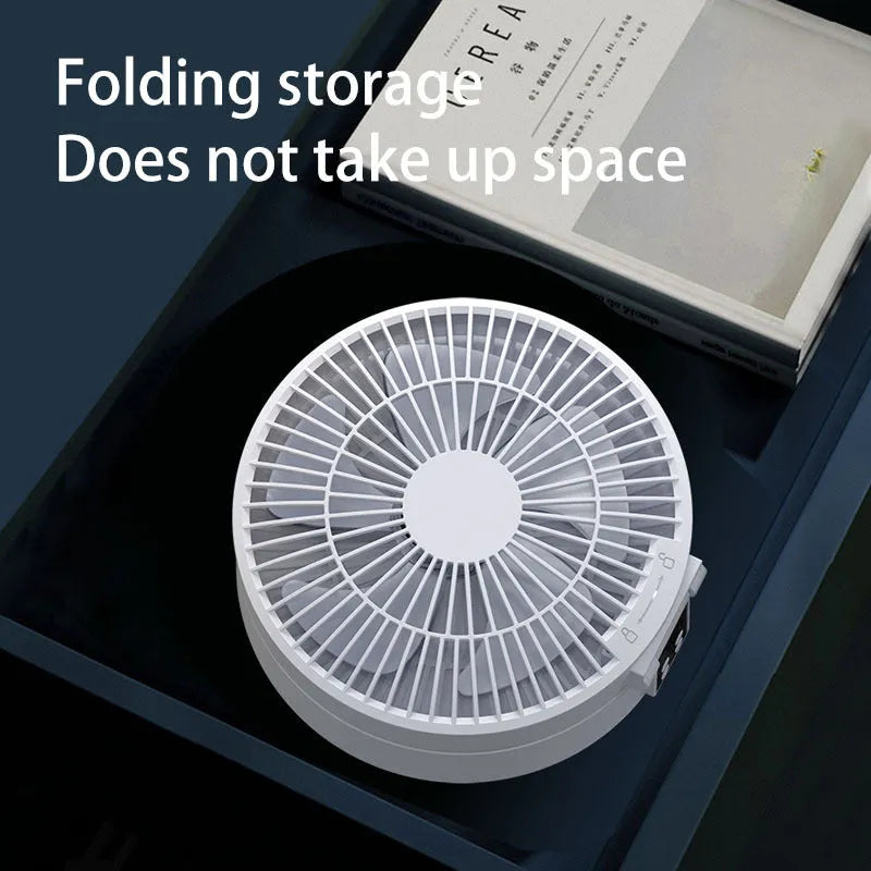 White portable rechargeable folding fan with remote control and night light on desktop