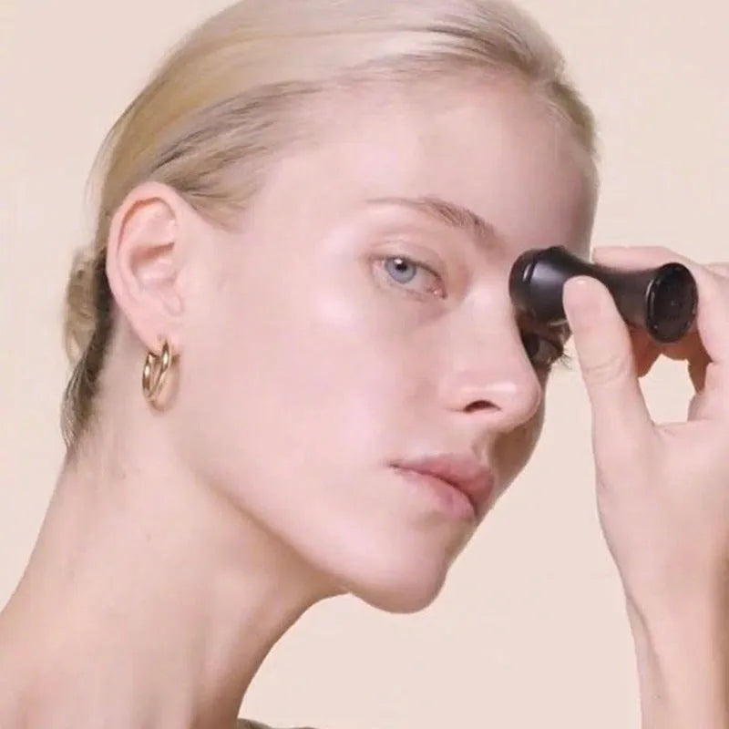 Volcanic stone facial roller in a plastic case for oily skin control, shown in one of four colours.