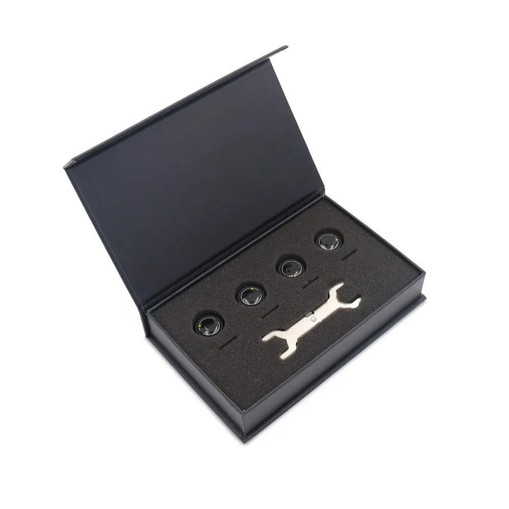 Black Bluetooth automotive tyre pressure monitoring system with four external sensors and a wrench.