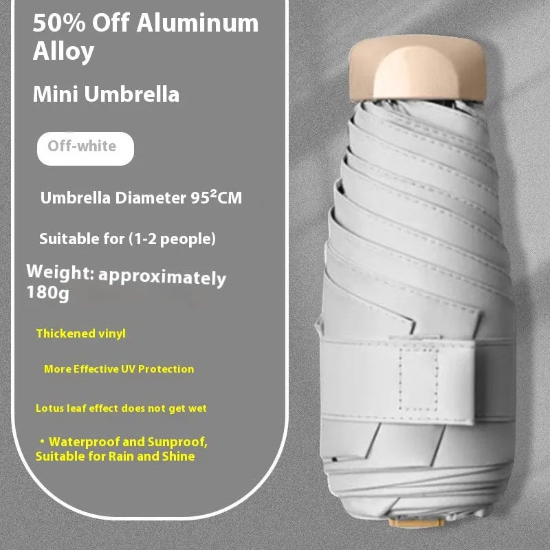 Five-fold compact umbrella with gradient vinyl canopy and manual open handle.