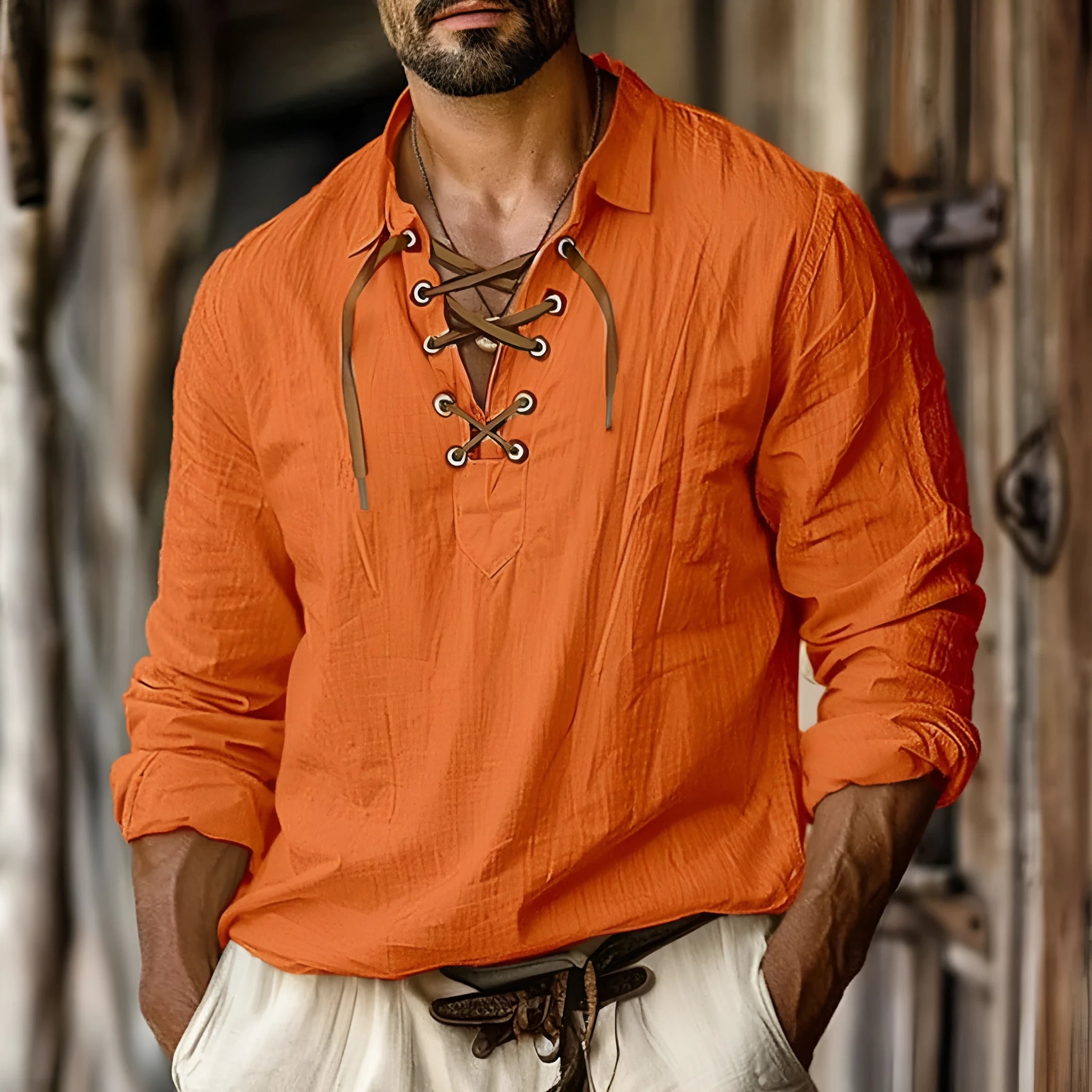 Men's loose fit linen blend shirt with lapels and lace design in blue, shown on a hanger.