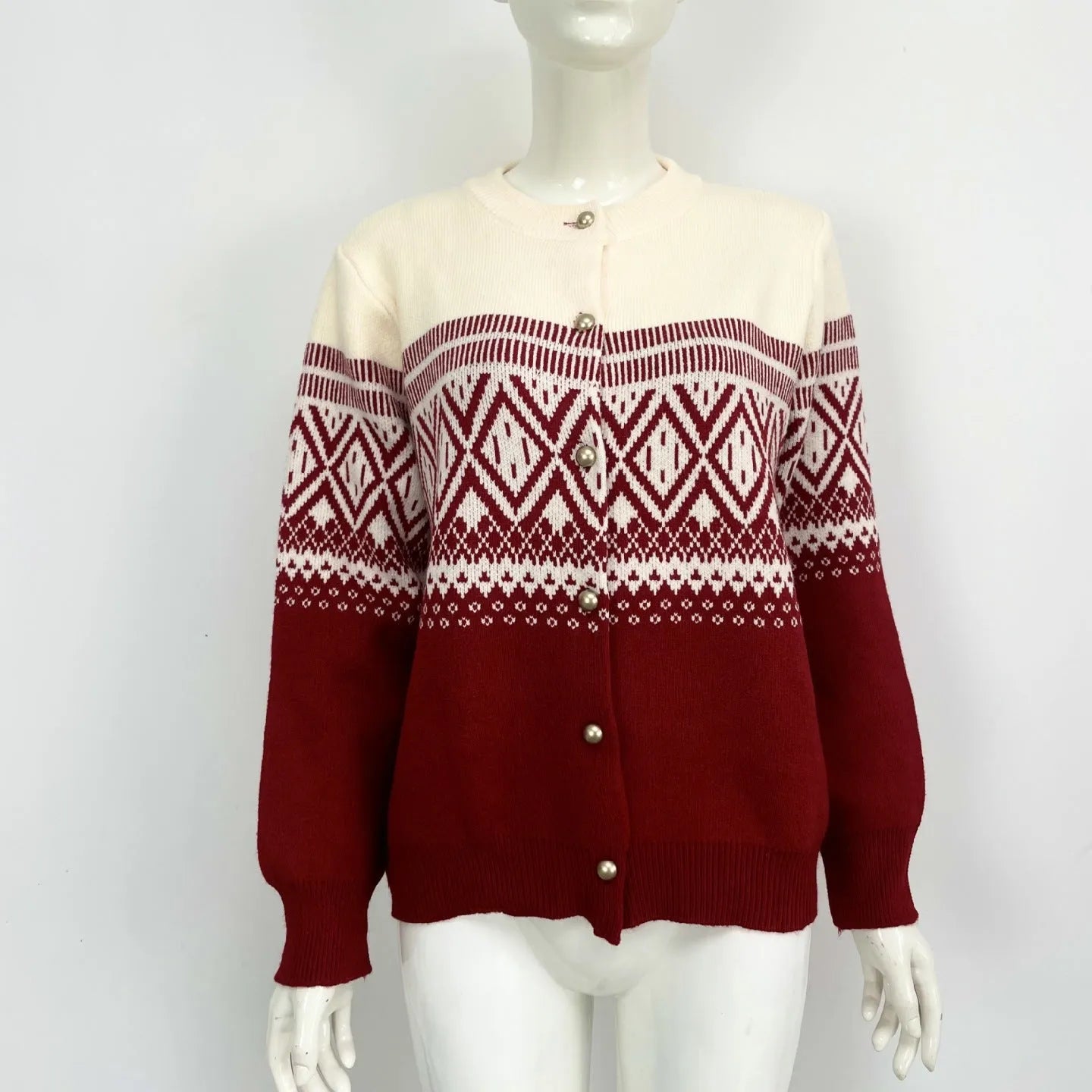 Women's long-sleeved grey alpaca wool cardigan with contrasting diamond knit pattern.