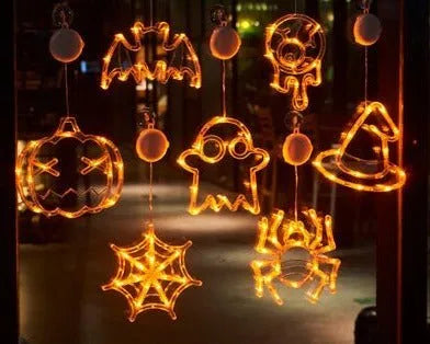 Halloween window hanging LED lights with spider, pumpkin and ghost designs on suction cups