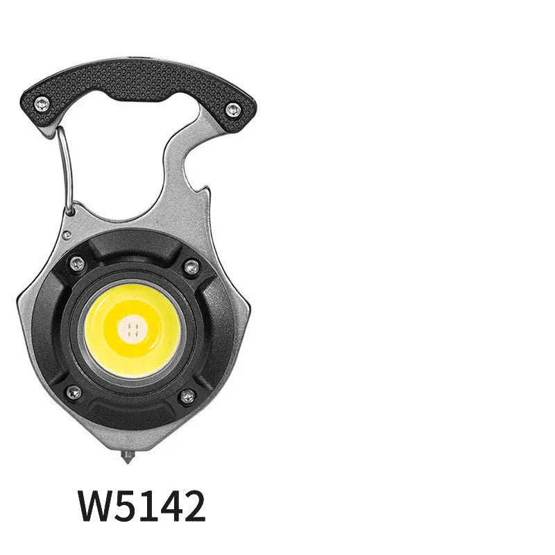 Compact silver and black keychain flashlight with multiple LEDs, a keyring loop, and a pointed window-breaking tip.