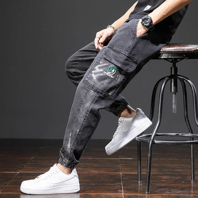 Men's loose fit cargo jeans in Korean style, showing straight leg and mid-waist design.