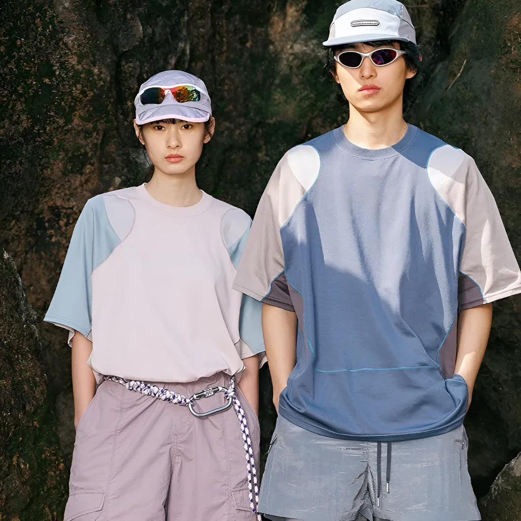 Men's loose blue patchwork t-shirt with raglan short sleeves on a mannequin.