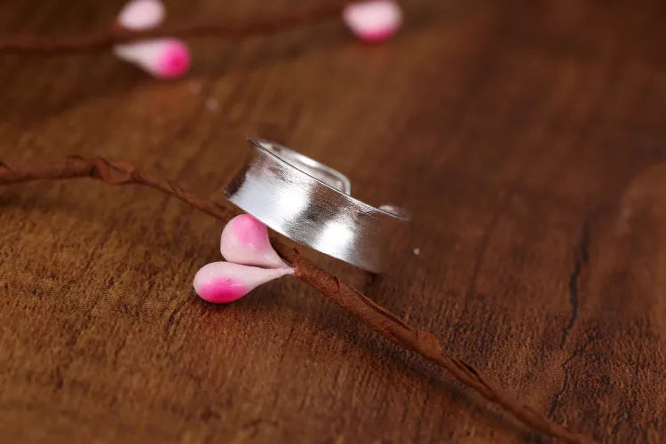 Adjustable geometric open ring with a Korean frosted sterling silver finish.