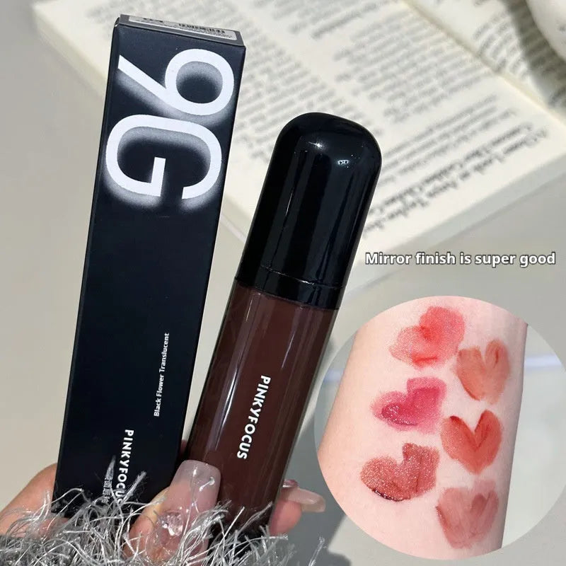 Black Citrus Mirror Lip Lacquer tube showcasing six colour shades: Black Tomato, Orange Brown, Bean Paste, Rose, And Red, Sweet Potato.