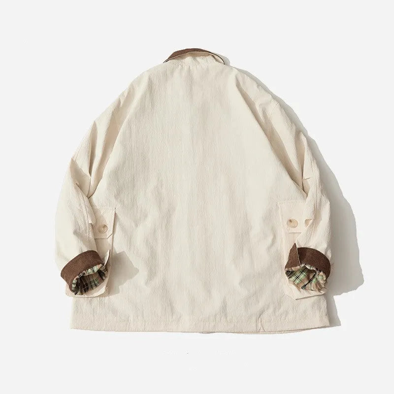 Green casual jacket with side seam pockets on a hanger