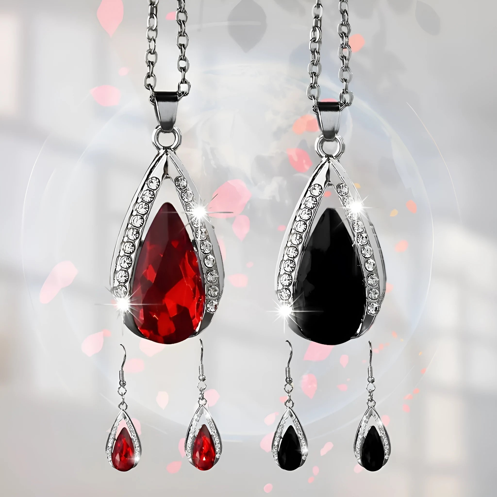 Black and red alloy water droplet pendant necklace and matching earrings jewellery suite.