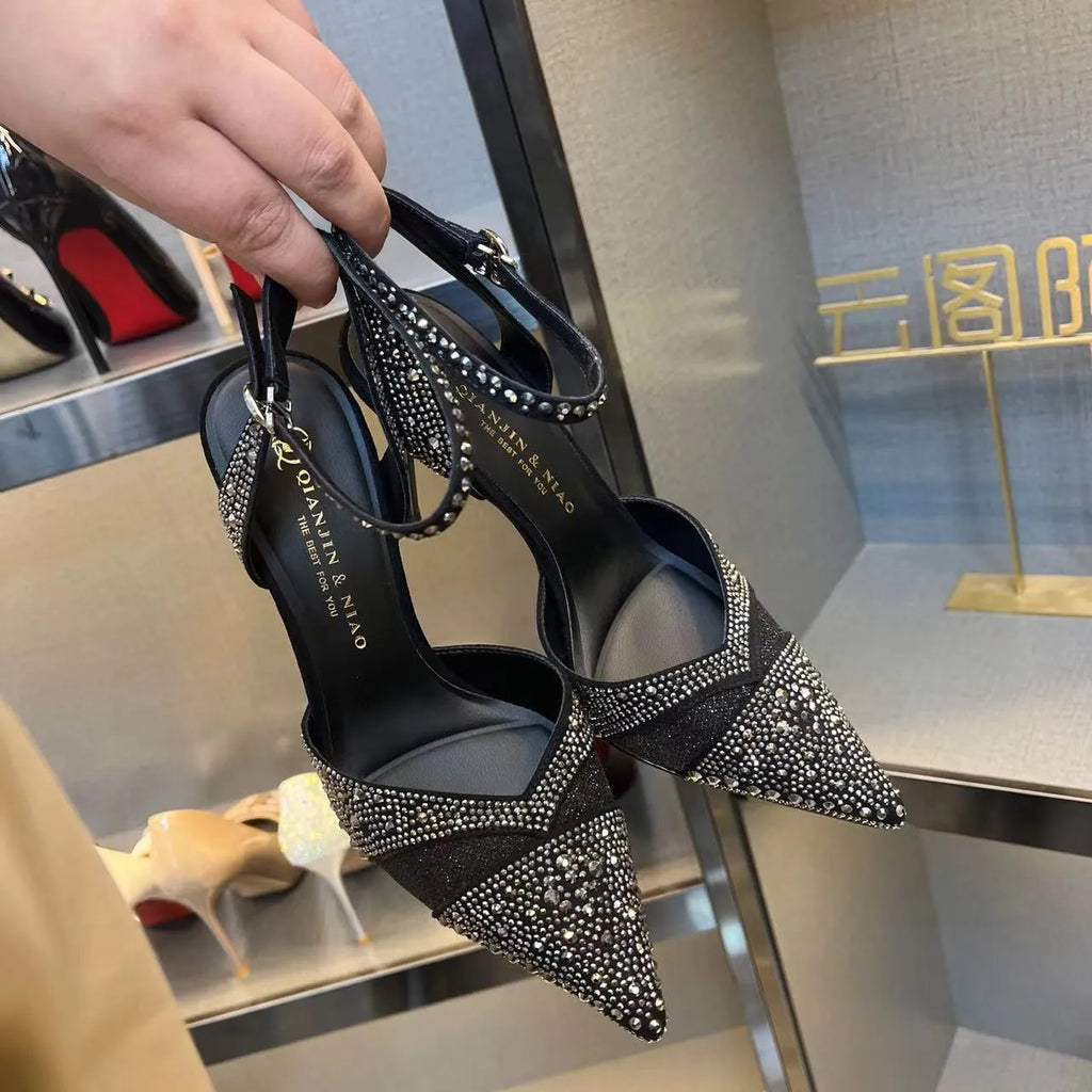 Women's black high heels with hollow stiletto heels and red soles, pointed toe design