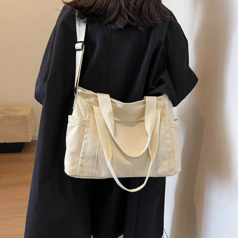 Large capacity polyester canvas shoulder tote bag in solid colour with phone compartment