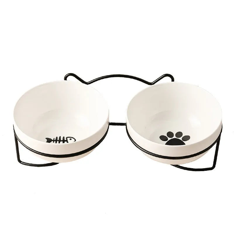 White ceramic cat bowl with decorative pattern and black iron frame support