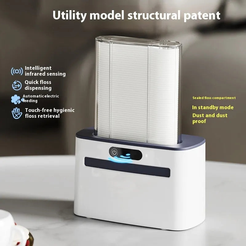 Dark grey automatic electric dental floss box with intelligent induction sensor on a bathroom countertop.