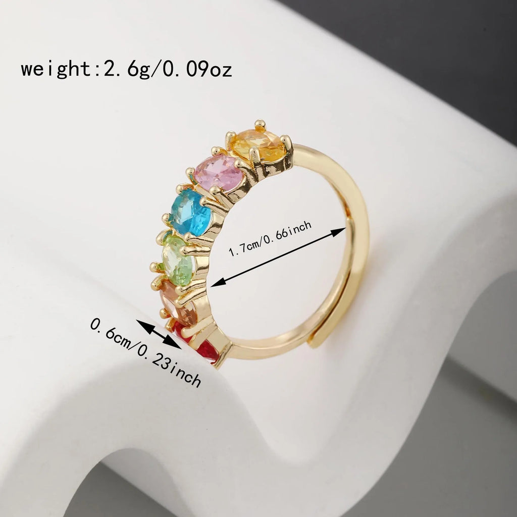 Gold-coloured adjustable zircon ring with a retro design on a copper band.