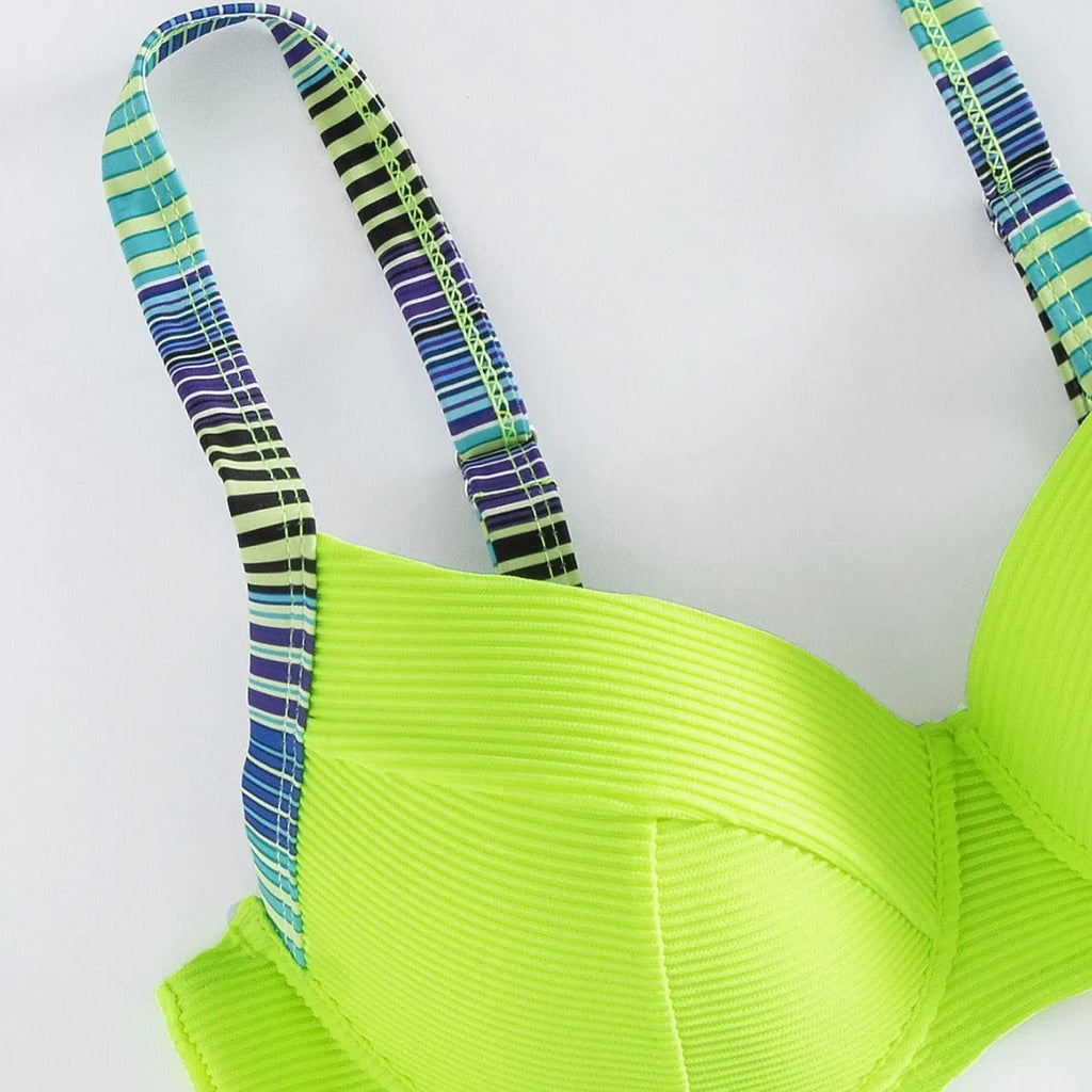 Green printed women's halter bikini set with split briefs on a mannequin