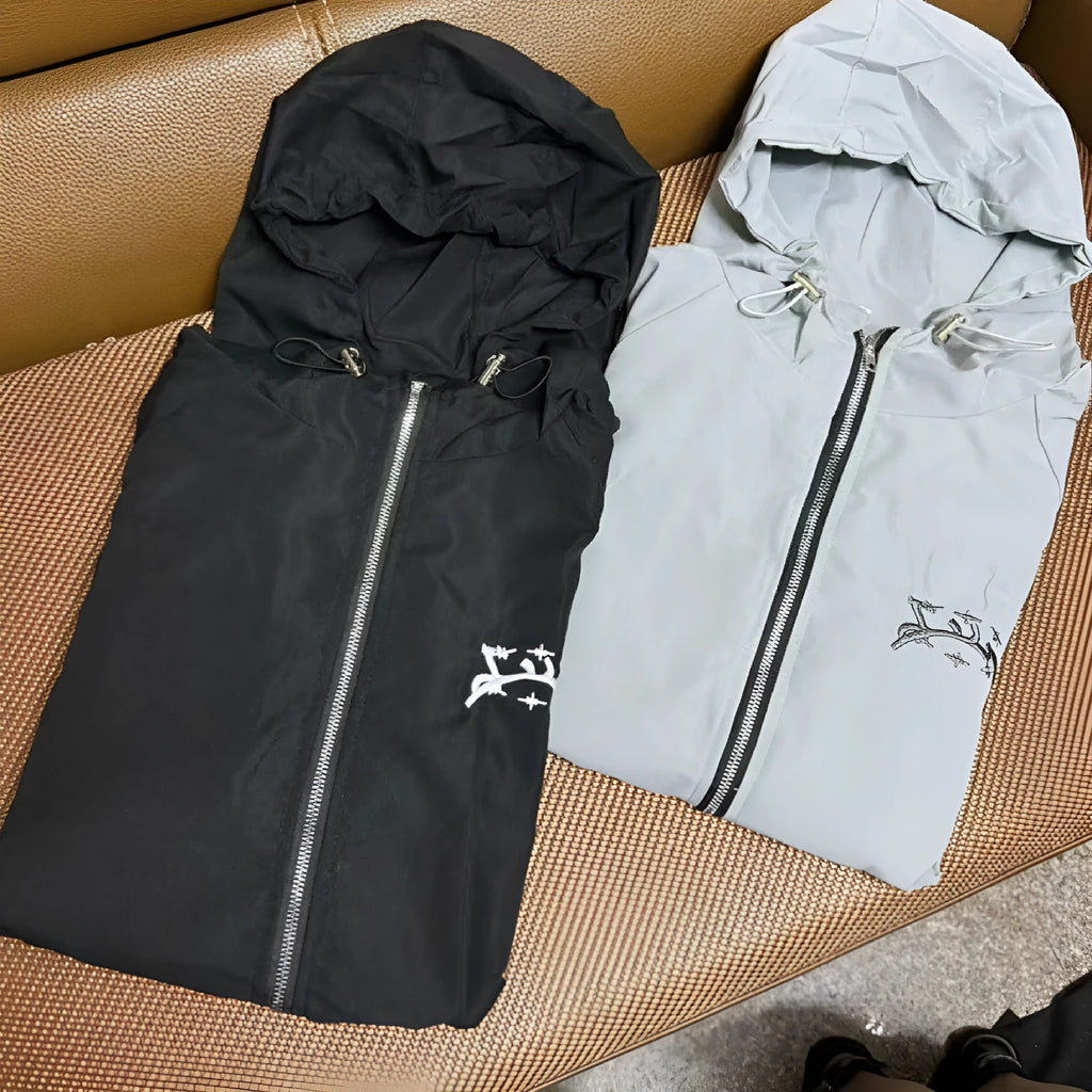 Grey loose fit men's hooded sunscreen jacket hanging, showing front design and hood.