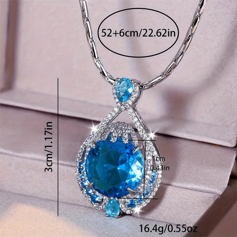 Geometric women's necklace with blue crystal pendant on water wave chain