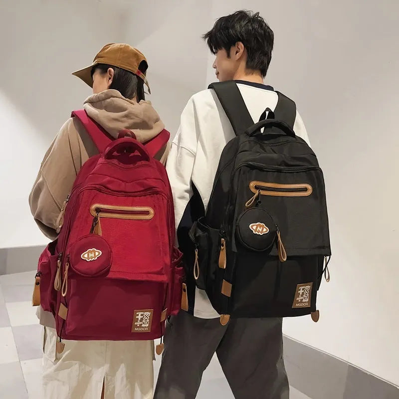 Large nylon school backpack in blue with curved shoulder straps and street style sewing detail