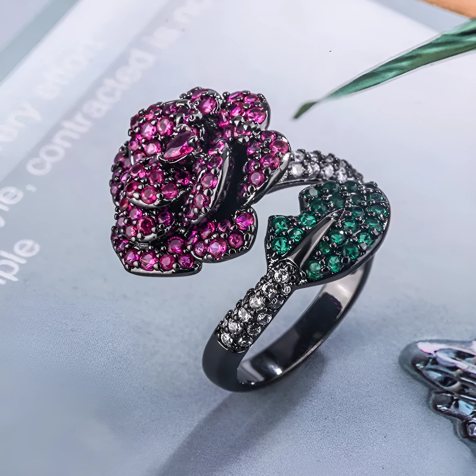 Gold-plated black gold ring with geometric shape and floral design featuring simulation red corundum elements