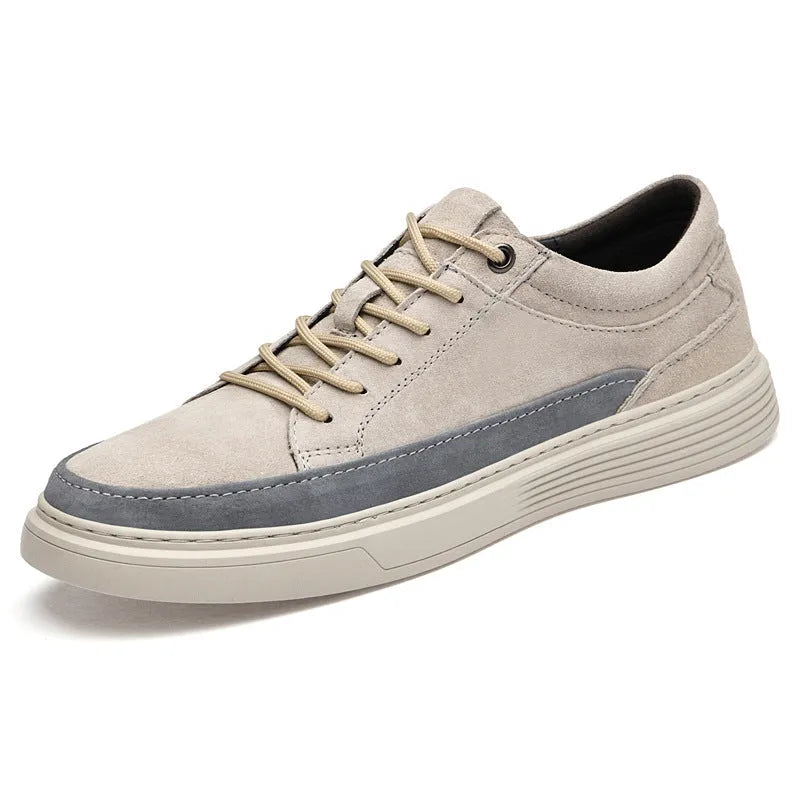 Men's grey low-top casual skate shoes with pigskin upper and rubber sole, shown from the side.