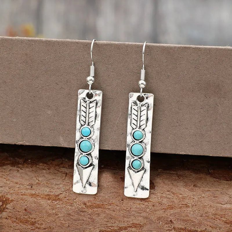 Women's silver geometric earrings with turquoise inlay detailing on long strip alloy design
