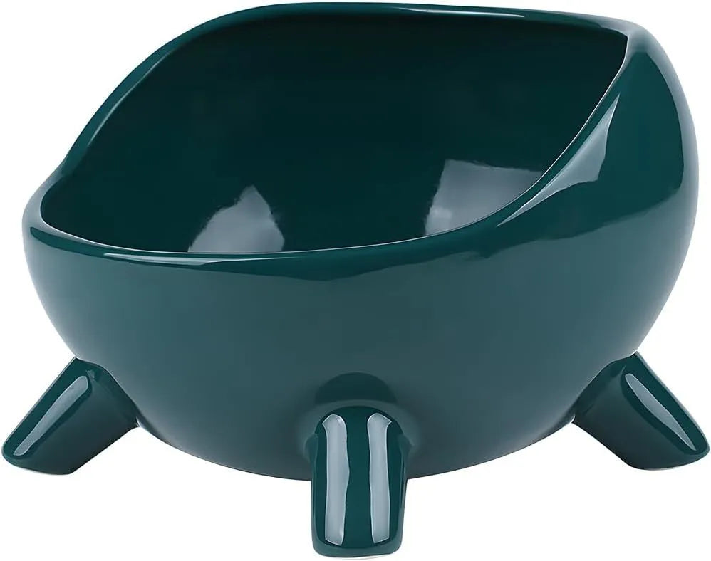 Green four-legged ceramic pet bowl for cats and small dogs on floor