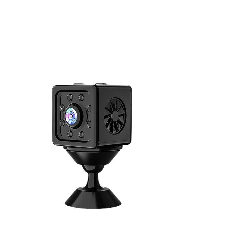 Black cubic network sports camera with mounting bracket on flat surface