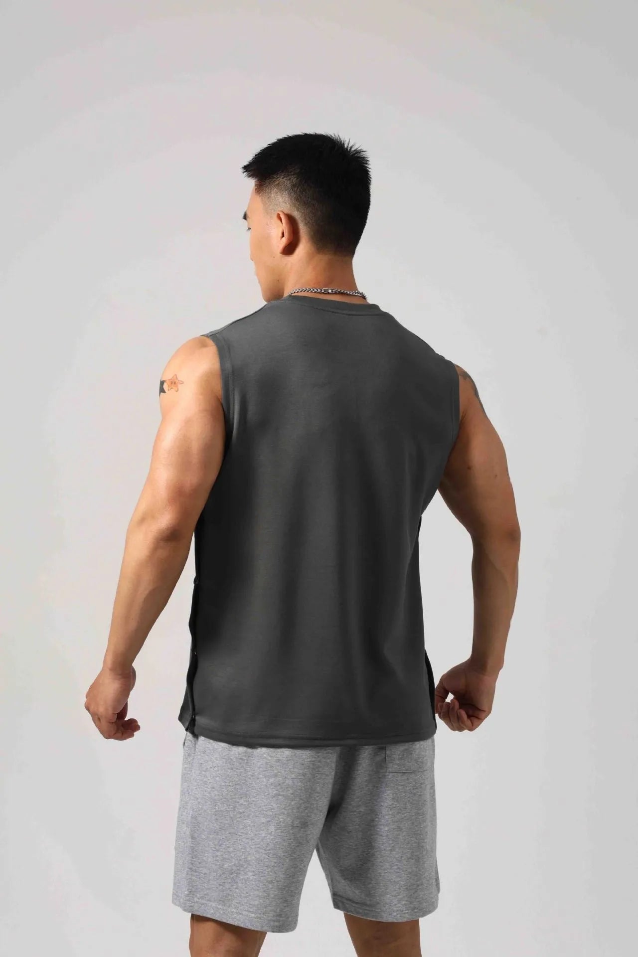 Men's Korean style loose fitness vest with two-side hidden hook opening in solid colour