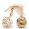 Two cat toys: a hollow rattan ball and a faux feather ball with a bell on a white background.