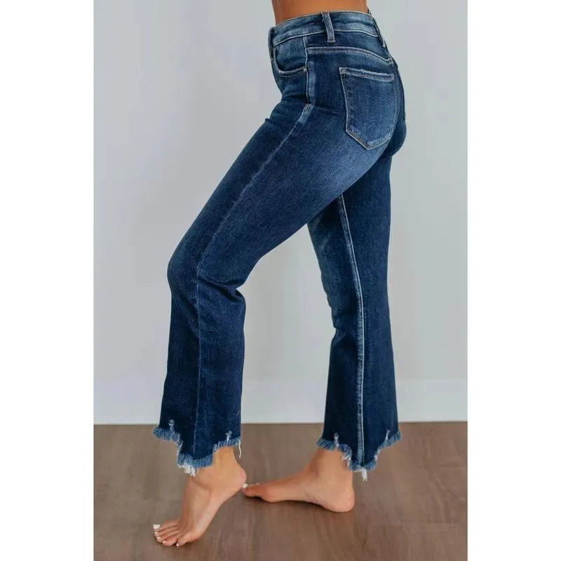 Women's solid blue denim trousers with a casual, hand-worn finish on a hanger.
