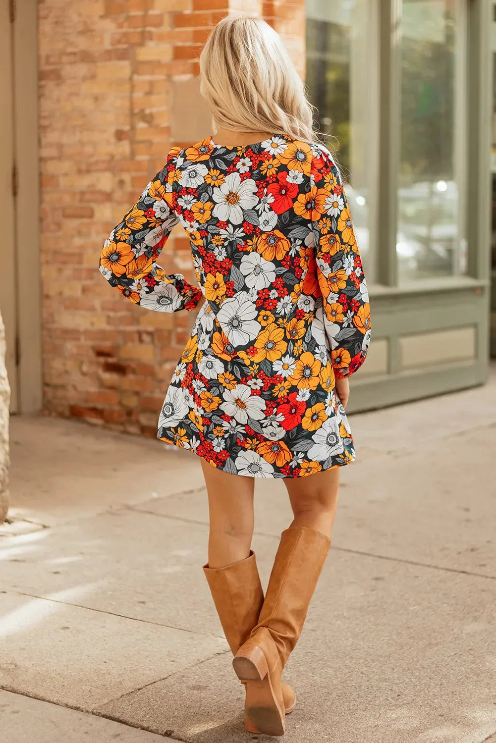 Orange floral print women's mini dress with striped lace detailing, v-neck, and long sleeves
