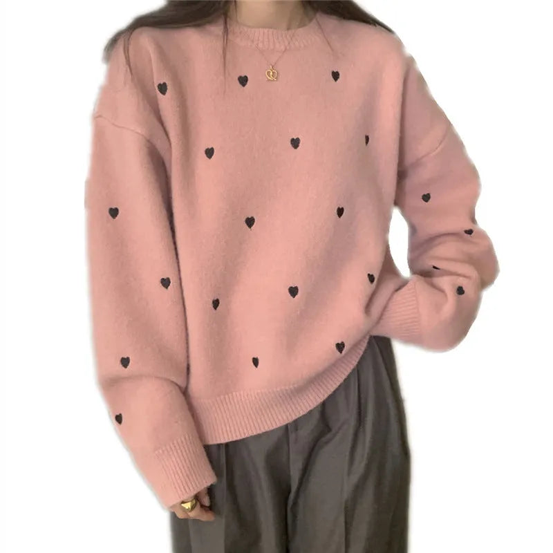 Women's loose fit grey acrylic pullover sweater with embroidery on the front.