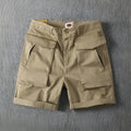 Men's straight-leg cotton cargo shorts in khaki with multiple pockets and micro-elastic stretch.