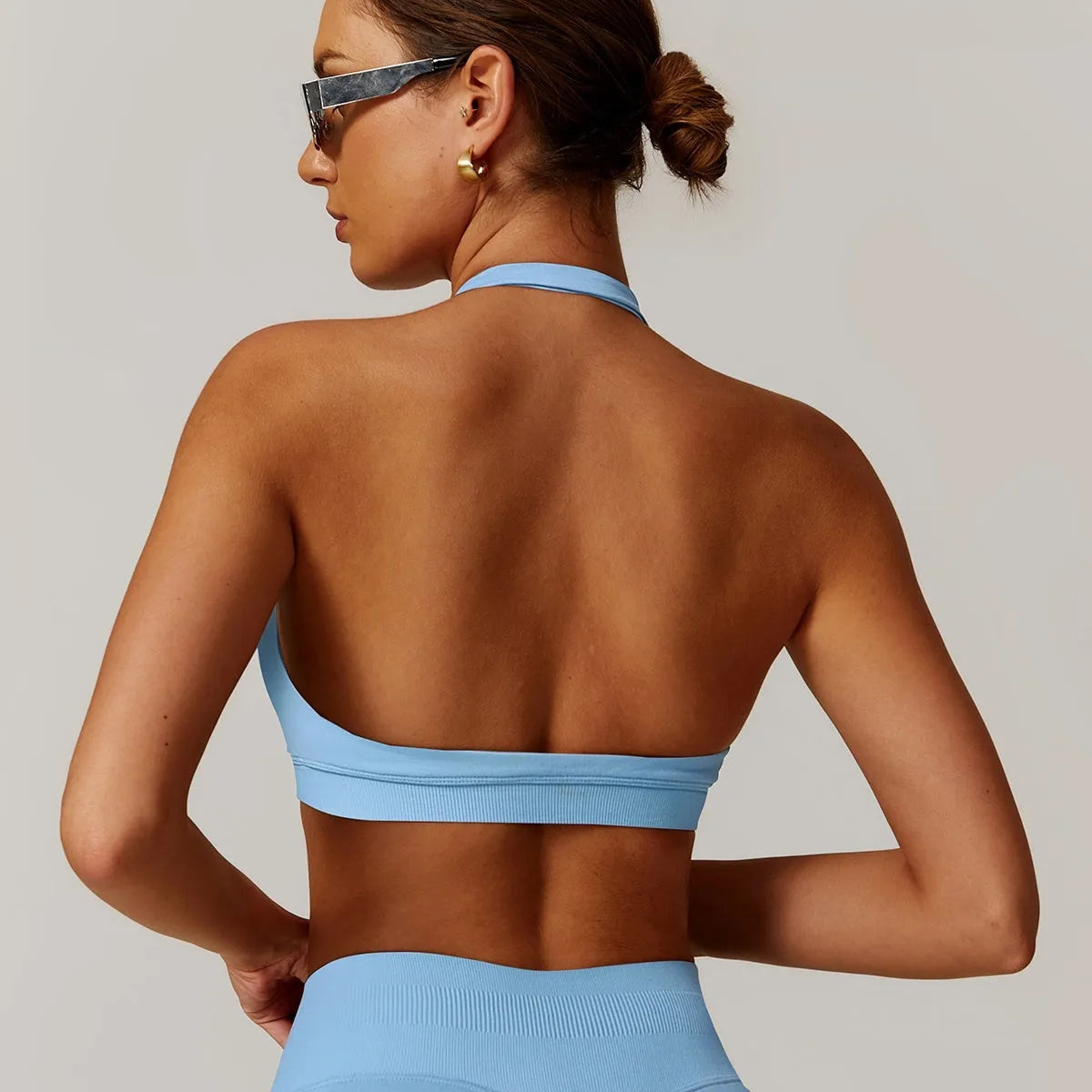Women's halter yoga bra with removable pads in five colour options showing front and back views