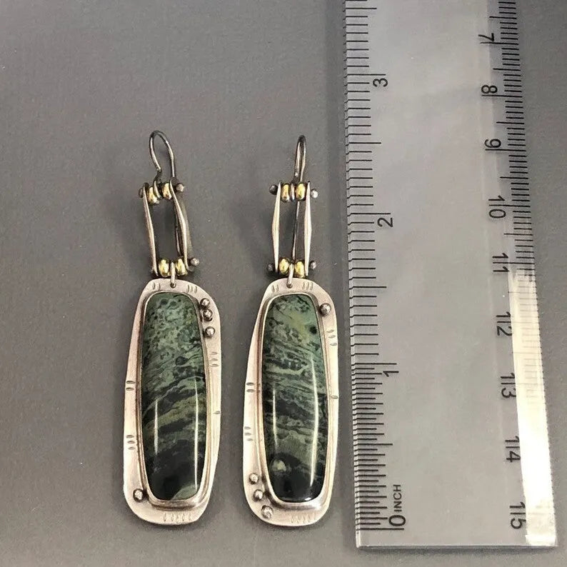 Two-tone geometric marble pattern alloy earrings with simple modern design