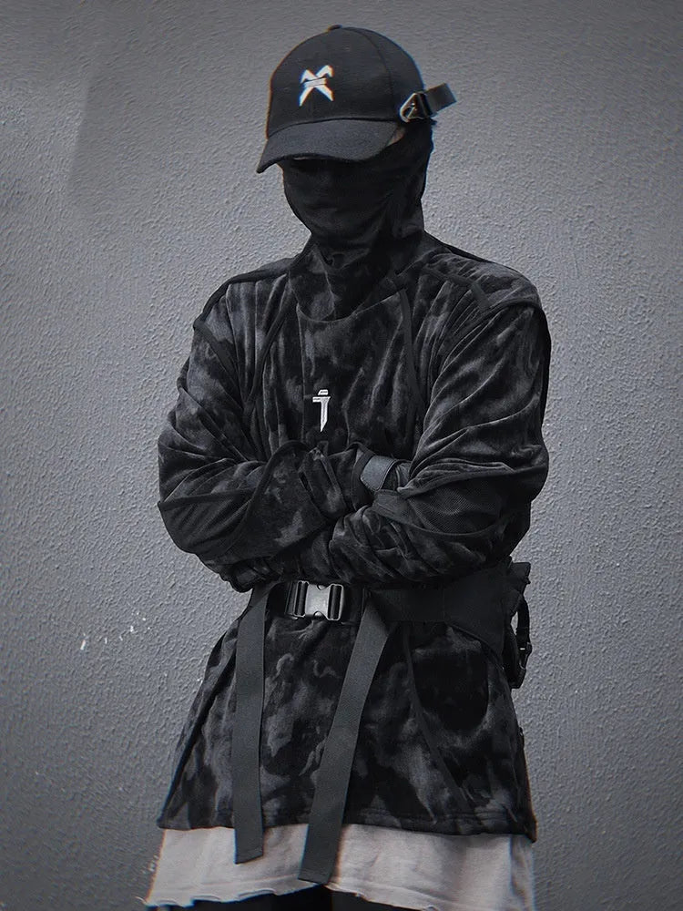 Man wearing a black and grey tie-dye print pullover sweater with loose fit and long sleeves.