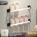 Black wall-mounted bathroom slipper rack with an integrated small seat, shown on a tile wall.