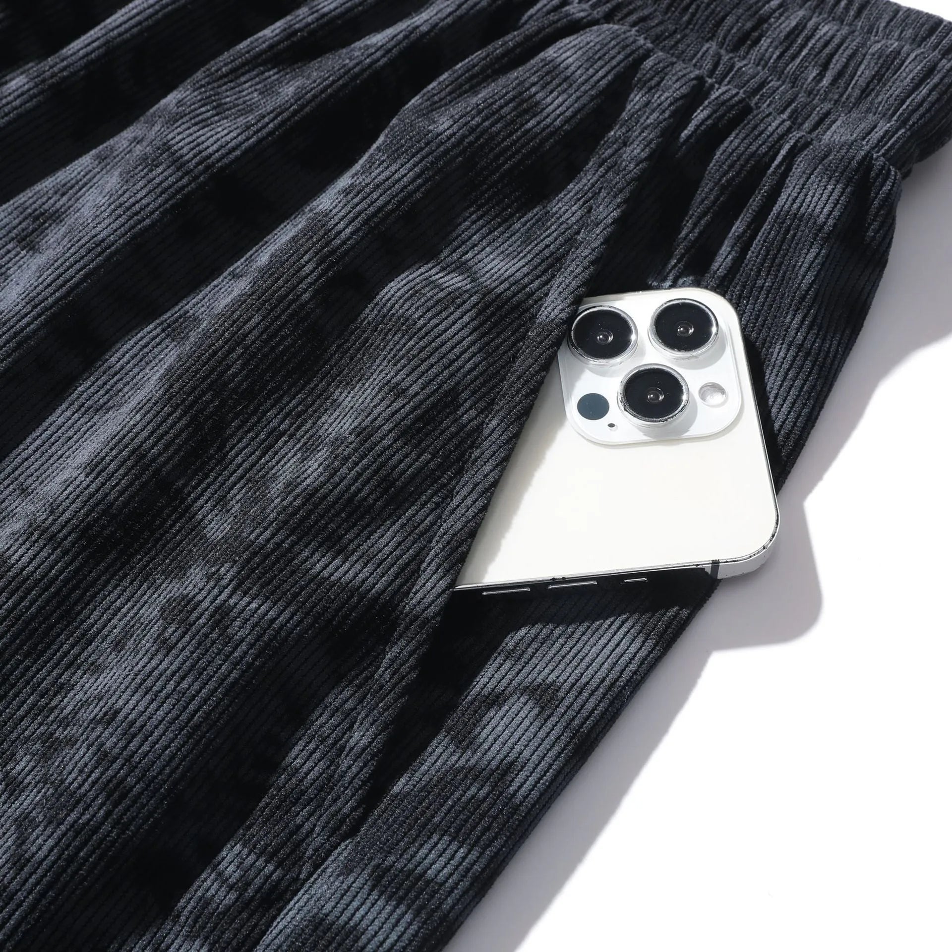 Men's camouflage patterned corduroy shorts with elastic high waistband in straight leg cut.