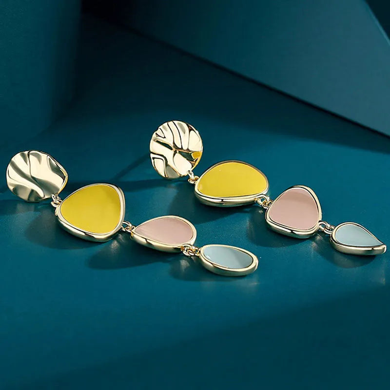 Morandi three-colour oil drip finish on a pair of simple alloy disc earrings with sterling silver posts.