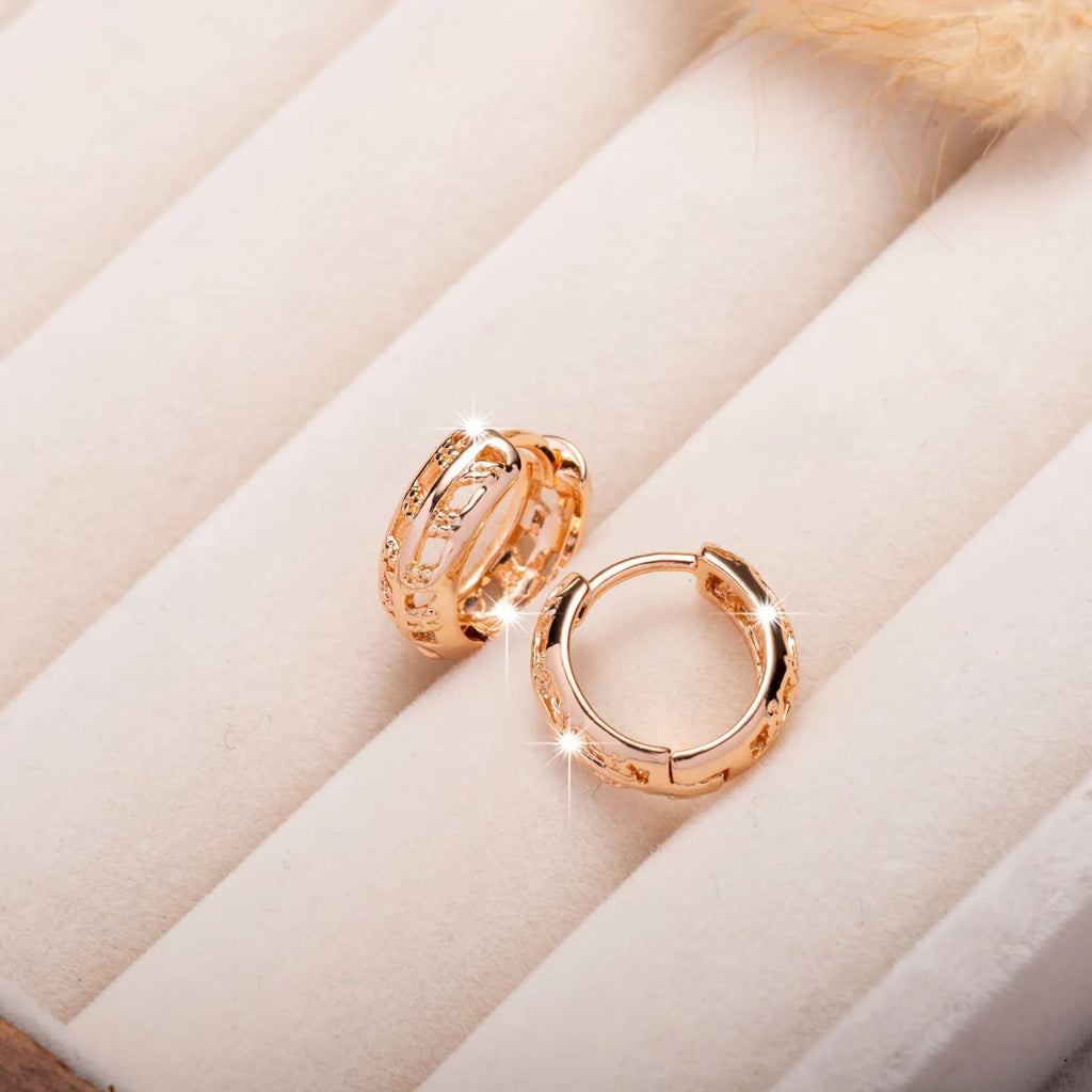 Rose gold plated hollowed-out copper earrings in a leaf shape design