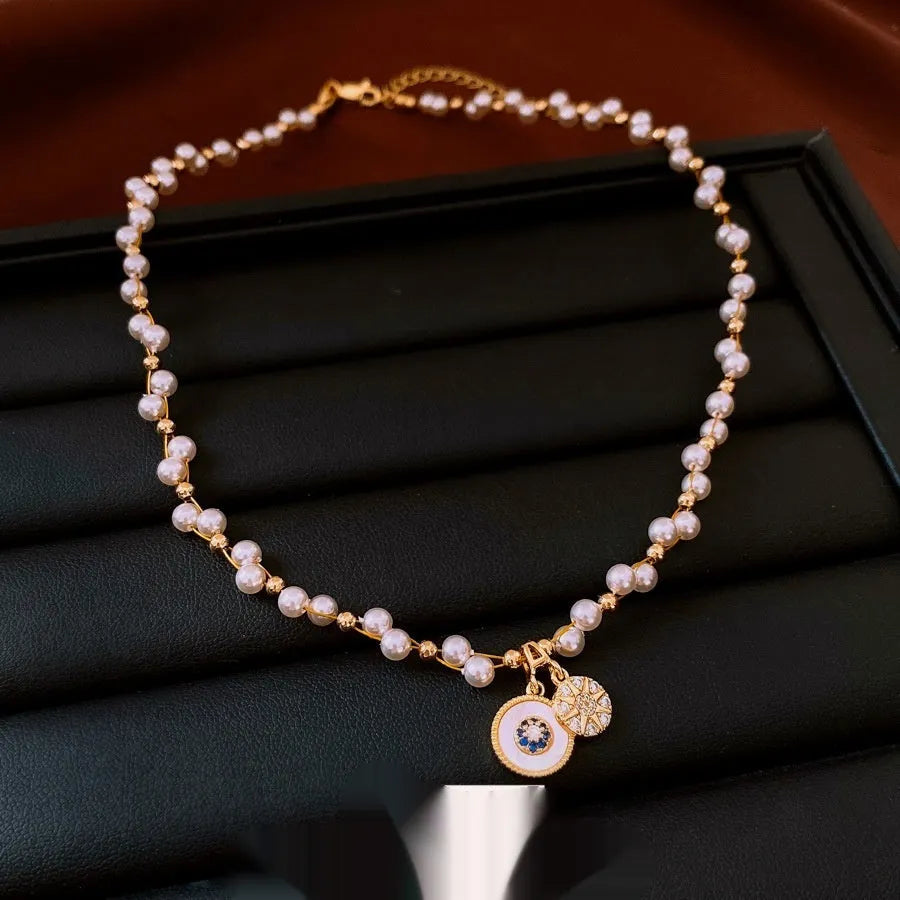 Women's gold electroplated round pendant necklace with zircon and imitation pearl on adjustable clavicle chain