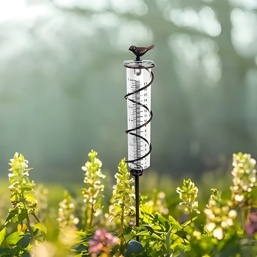 Cast iron and glass rain gauge with hummingbird design for garden rainfall measurement