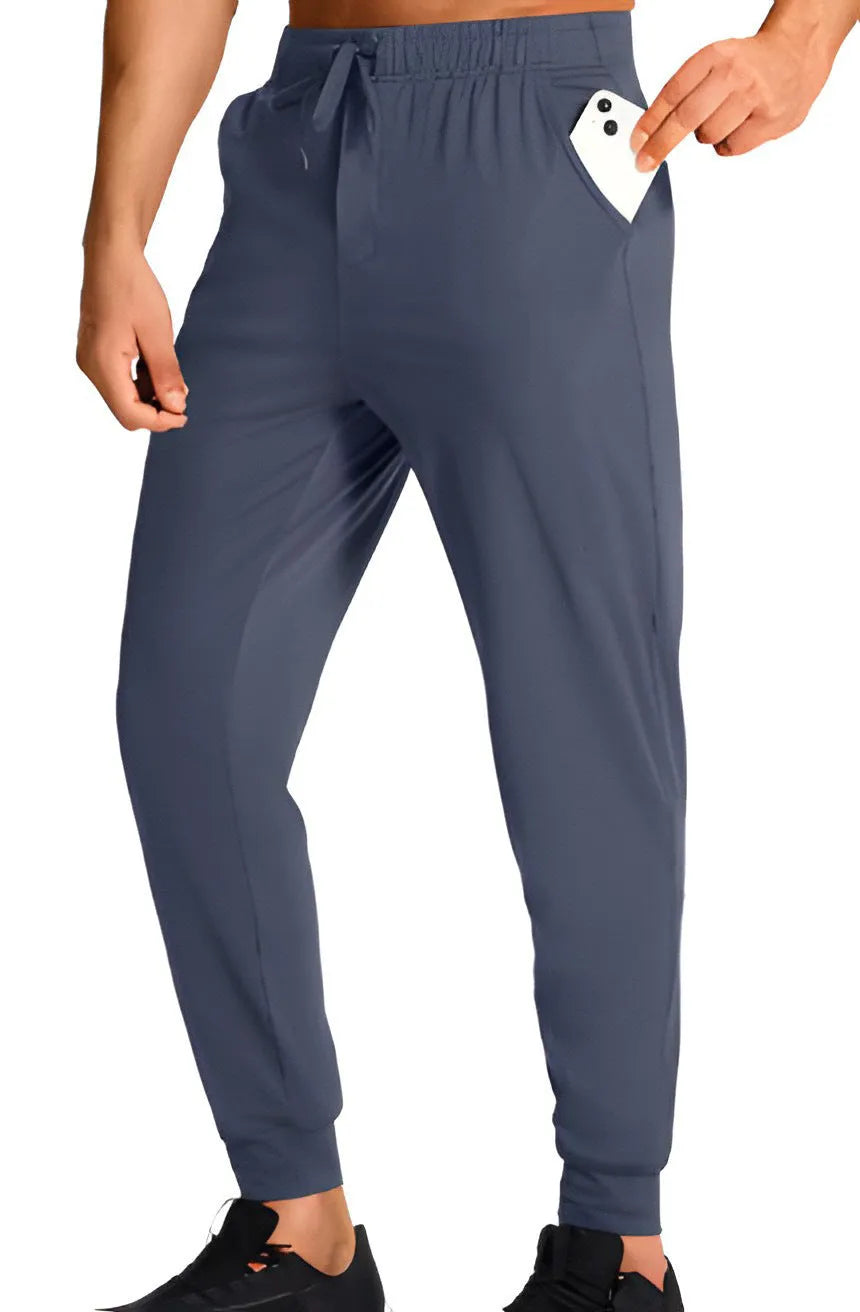 Men's loose casual polyester trousers in solid colour with size range label