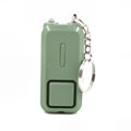 Pink personal security alarm showing compact size next to LR44 batteries