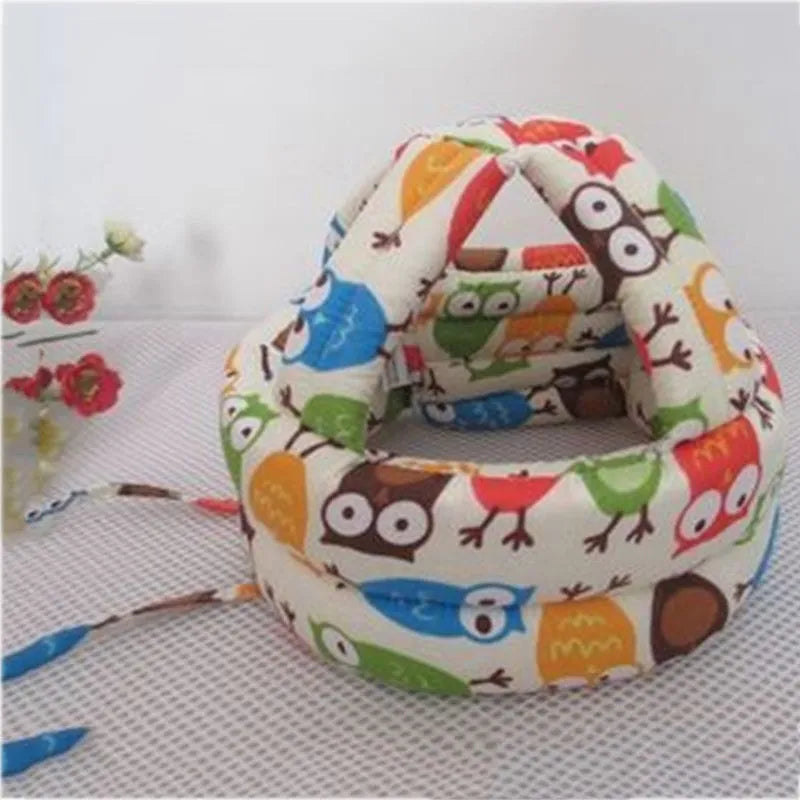 Baby anti collision hat with high-density sponge padding, adjustable headband, breathable cotton outer, colourful design