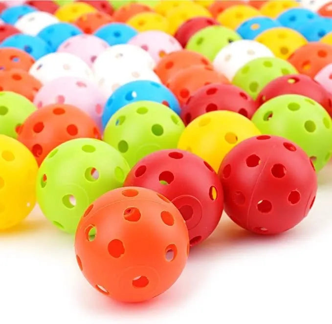 Multi-colour golf practice balls in net bag with 26-hole putting layout for skill development