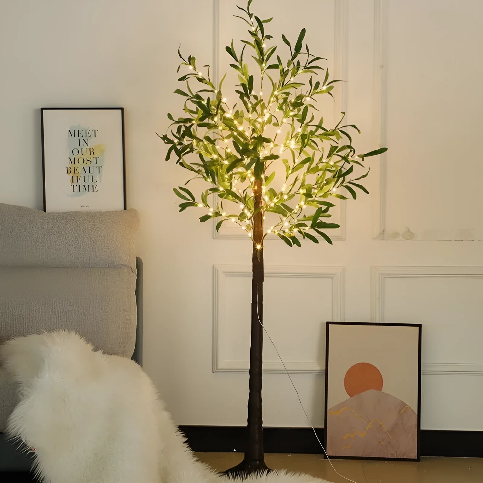1.8 metre tall artificial olive tree lamp with warm LED lights illuminating courtyard decoration