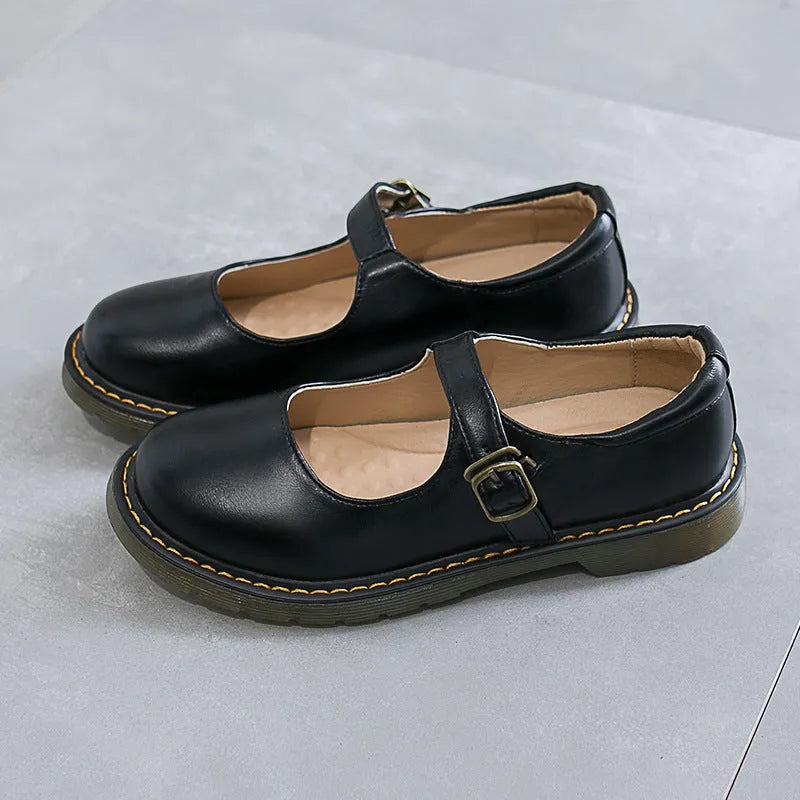 Women's solid colour round head low-cut flat retro shoes with buckle, black colour option, side view