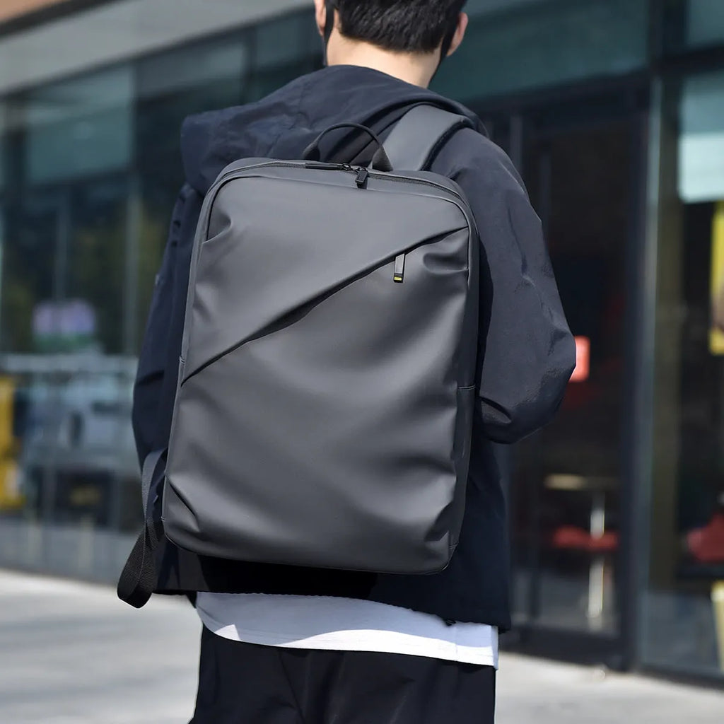 Large black waterproof backpack with 40 litre capacity and PU leather construction